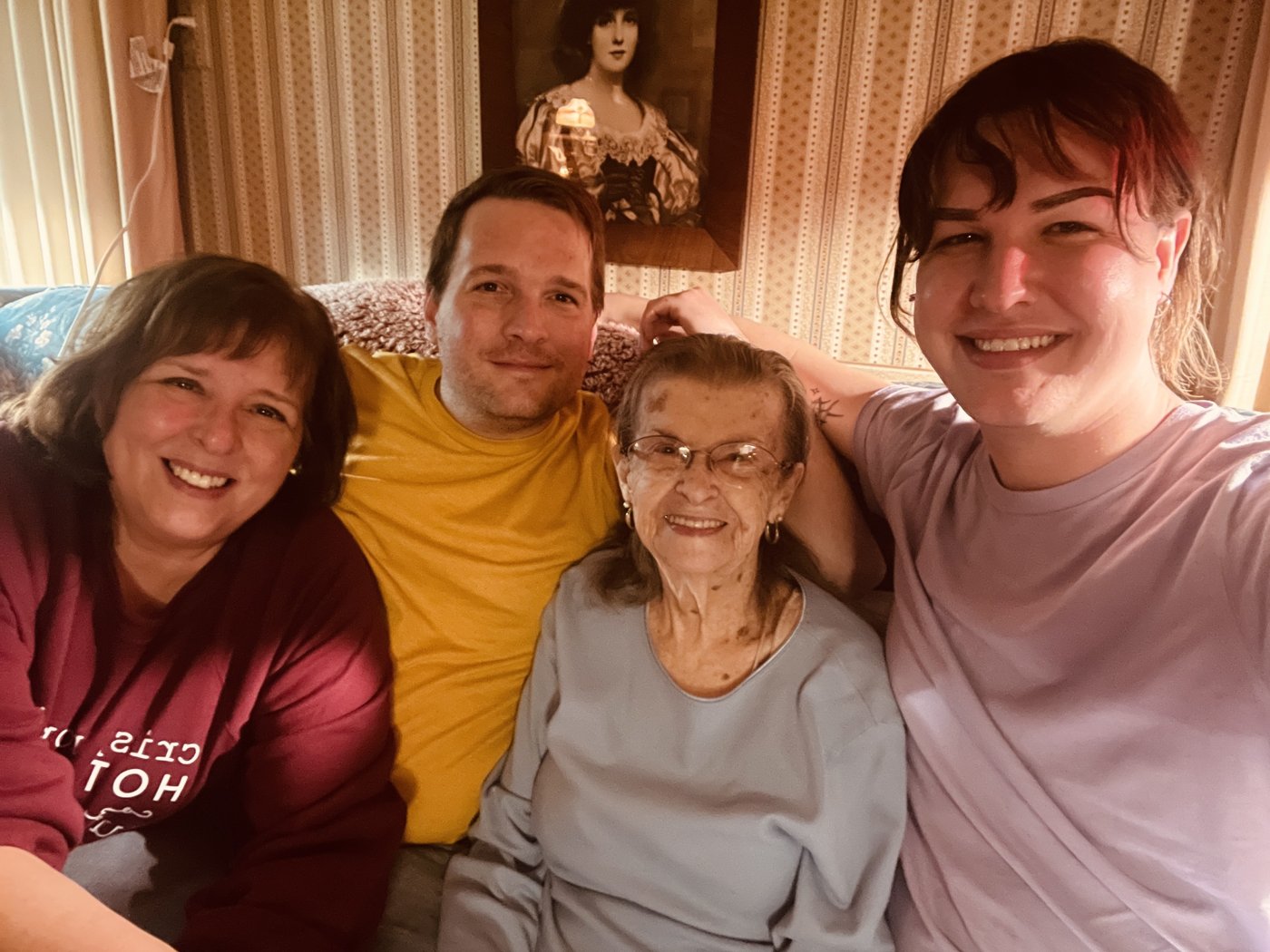 Brian and family on the couch with Grandma