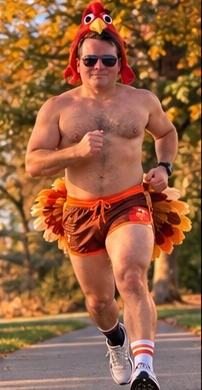 The Double Gobbler running in turkey shorts and a turkey hat